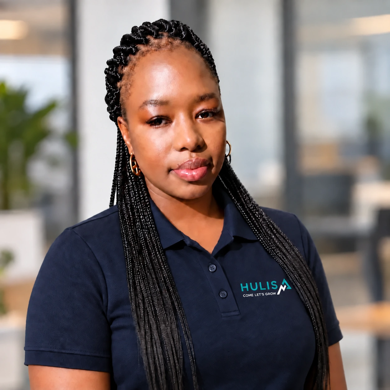 Taetso wearing a navy Hulisa polo