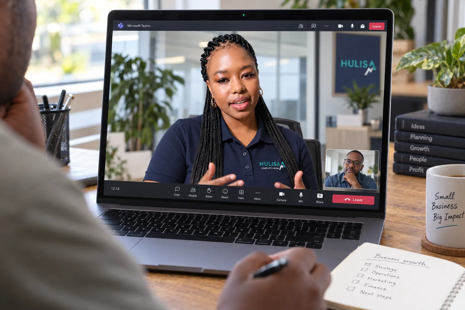 Illustrative Teams discussion with Taetso in Hulisa merchandise, focused on a client’s laptop screen